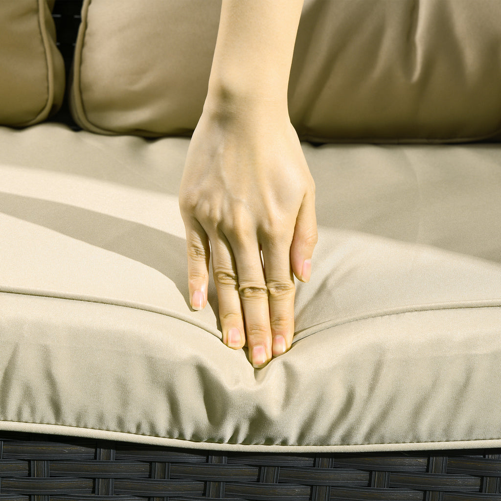 Hand resting on a beige cushioned chair
