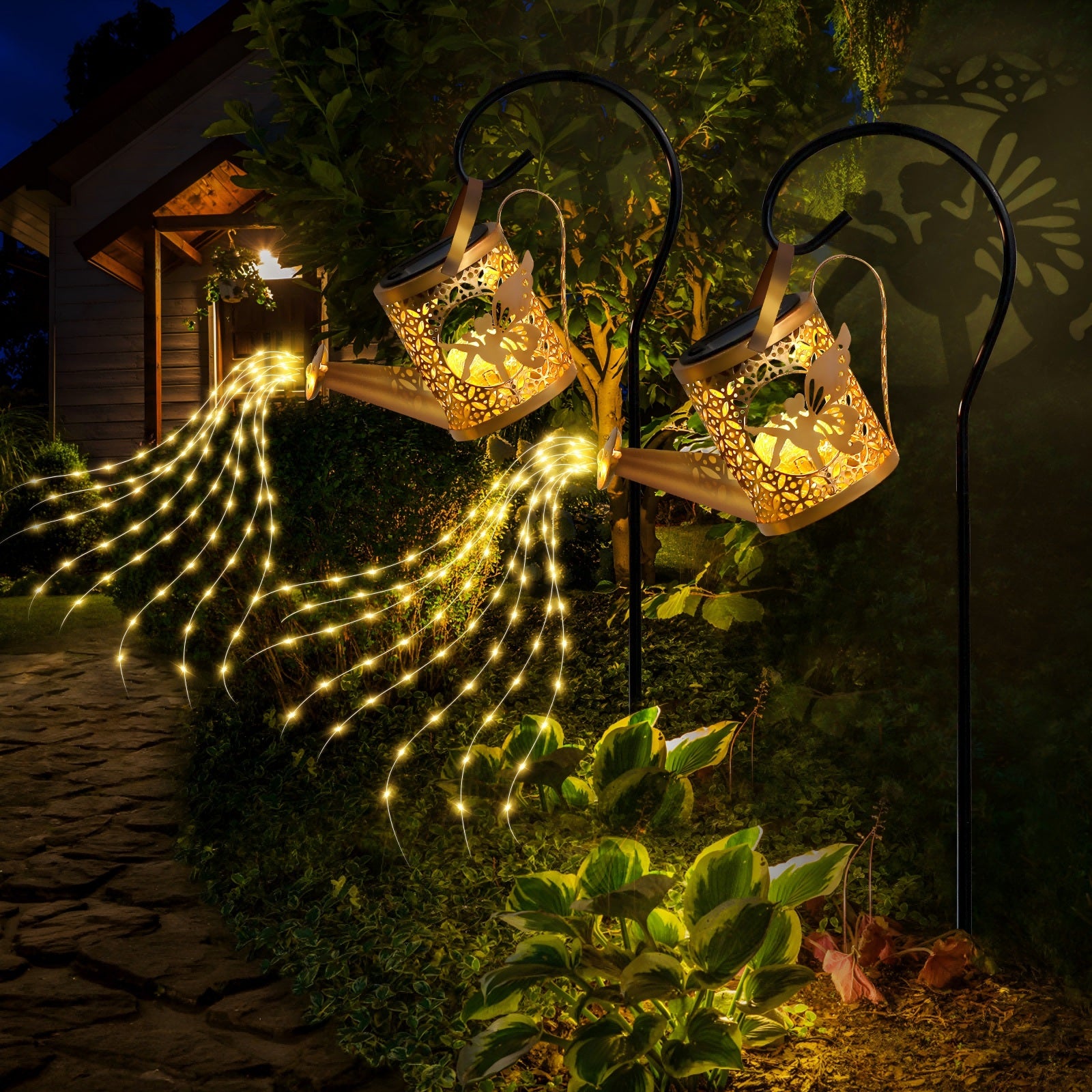 Decorative outdoor lights shaped like deer heads with string lights in a garden setting.