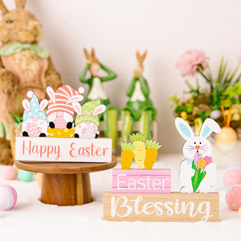 Decorative Easter items including a rabbit figurine, 'Happy Easter' sign, and 'Easter Blessing' sign on a white surface.