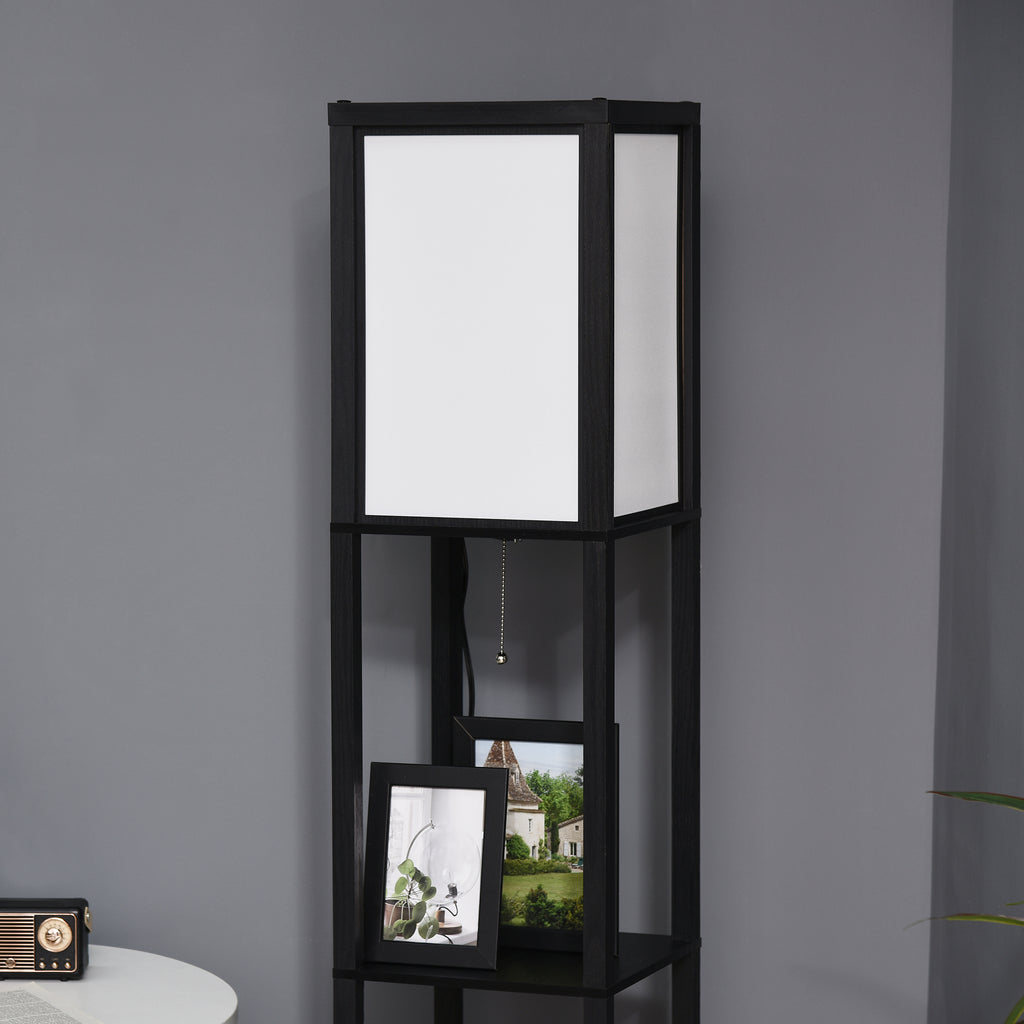 Black shelving unit with a white lampshade against a gray wall