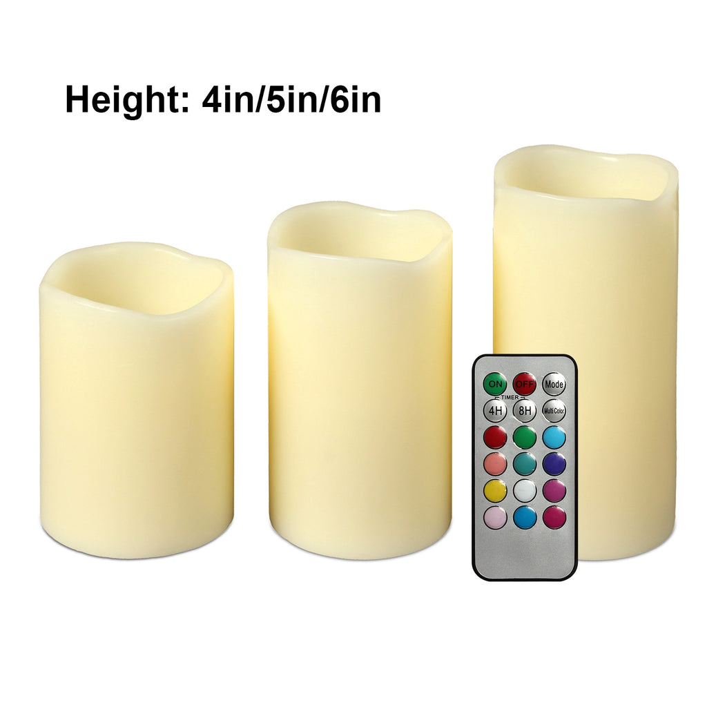 Three LED candles of different heights with a remote control on a white background