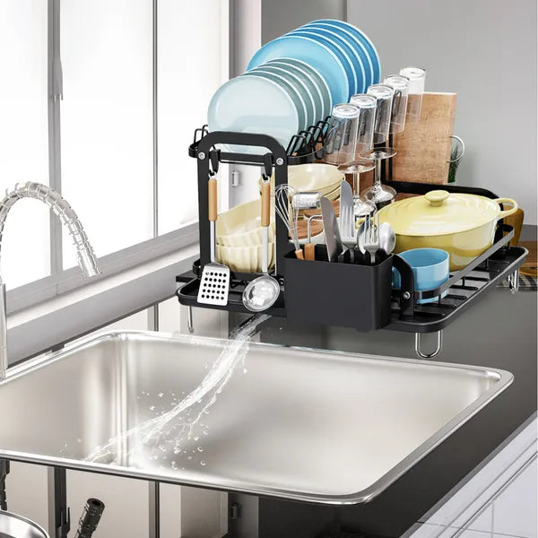 Dish rack with dishes above a kitchen sink