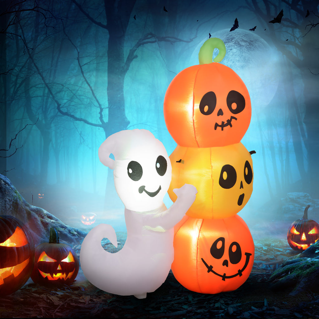 Inflatable ghost and pumpkins with smiling faces against a Halloween-themed background.