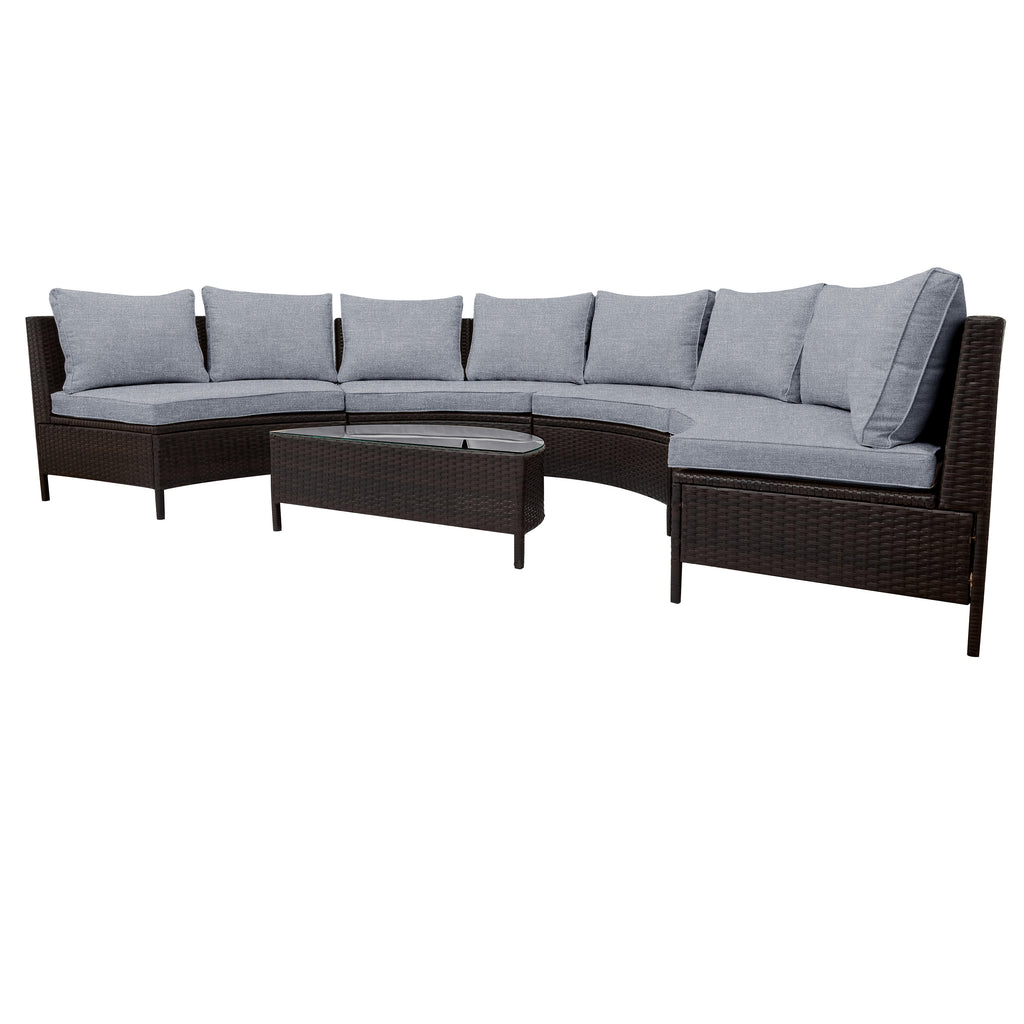 Sectional outdoor sofa with gray cushions and a round coffee table on a white background