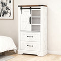 White storage cabinet with sliding door in a bedroom setting