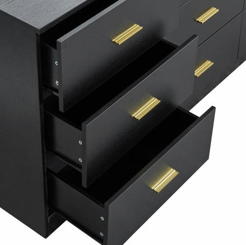 Black dresser with open drawers and gold handles on a white background