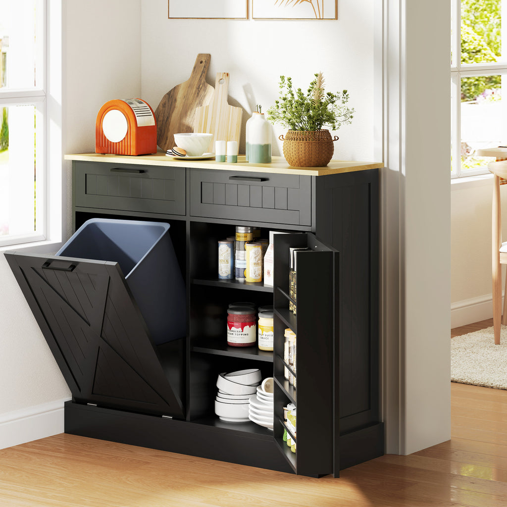 Black storage cabinet with a pull-out trash bin in a kitchen setting.