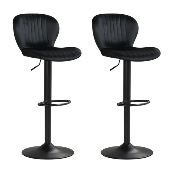Two black swivel bar stools with cushioned seats positioned at a modern kitchen island with wood cabinetry