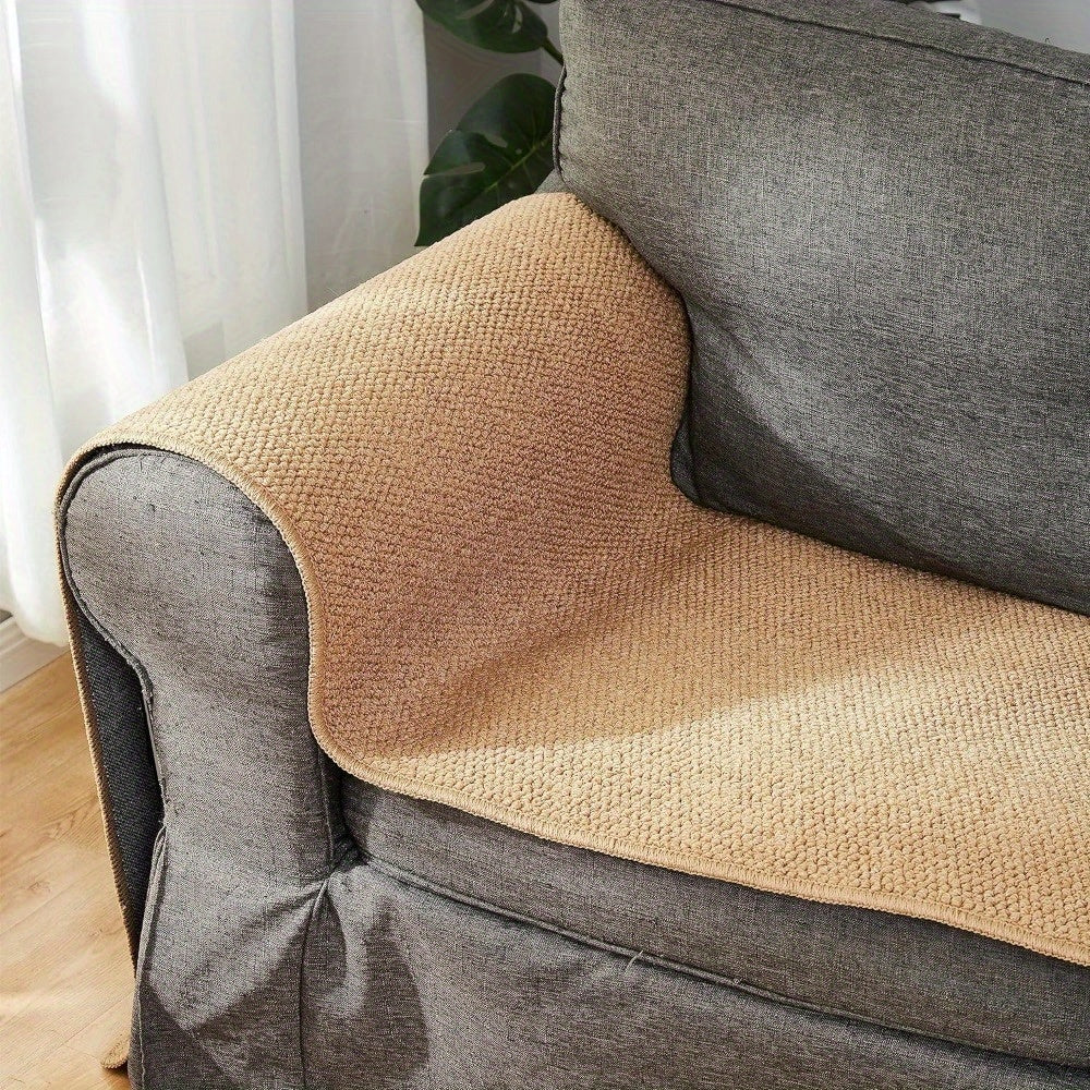 Brown textured armrest cover on a gray armchair