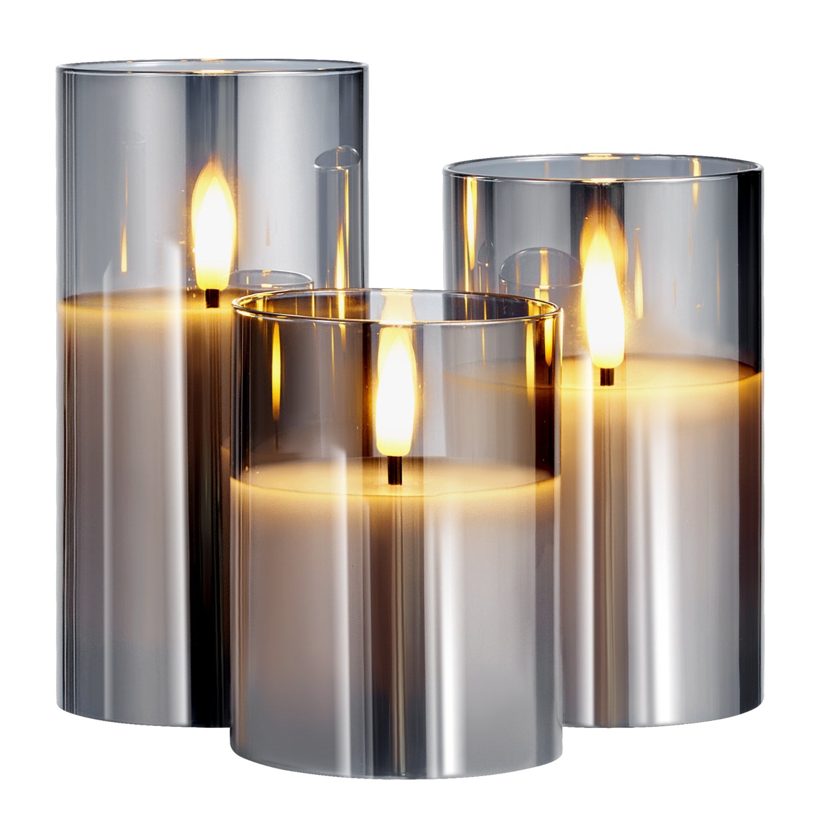 Set of three metallic candle holders with lit candles inside on a white background