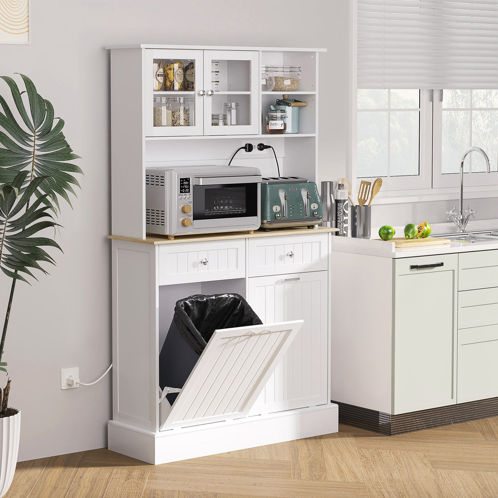 White kitchen cabinet with a built-in laundry basket in a modern kitchen setting.