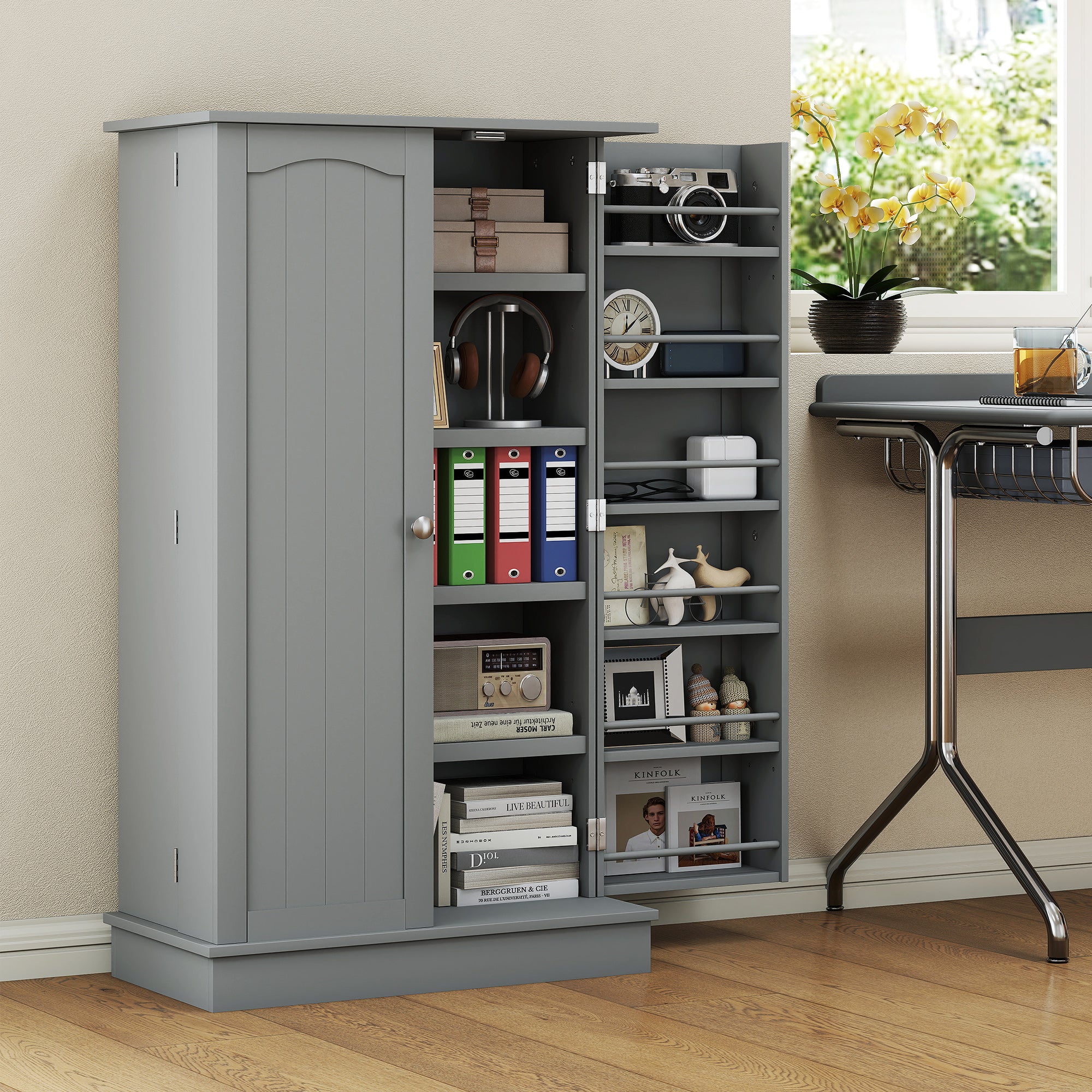 Gray storage cabinet with open doors displaying various items in a room with a desk and window.