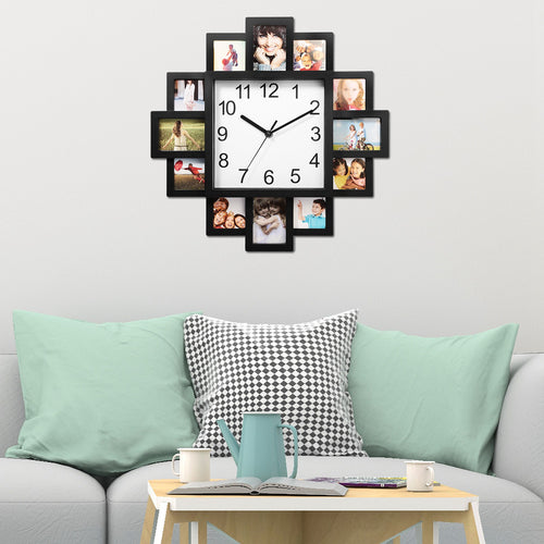 Wall clock with photo frames on a wall above a sofa with cushions.
