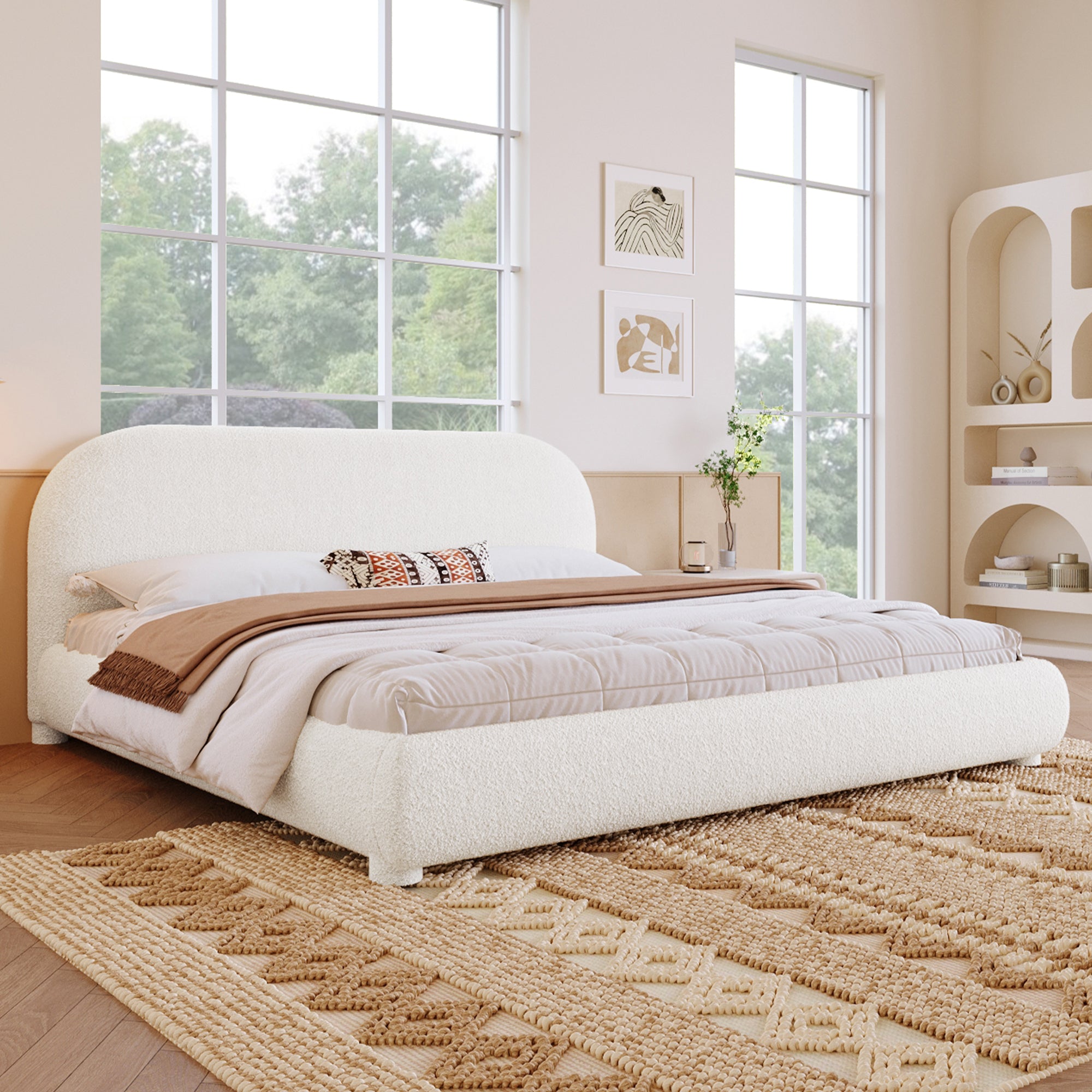 Modern bedroom with a large bed, windows, and decorative elements.
