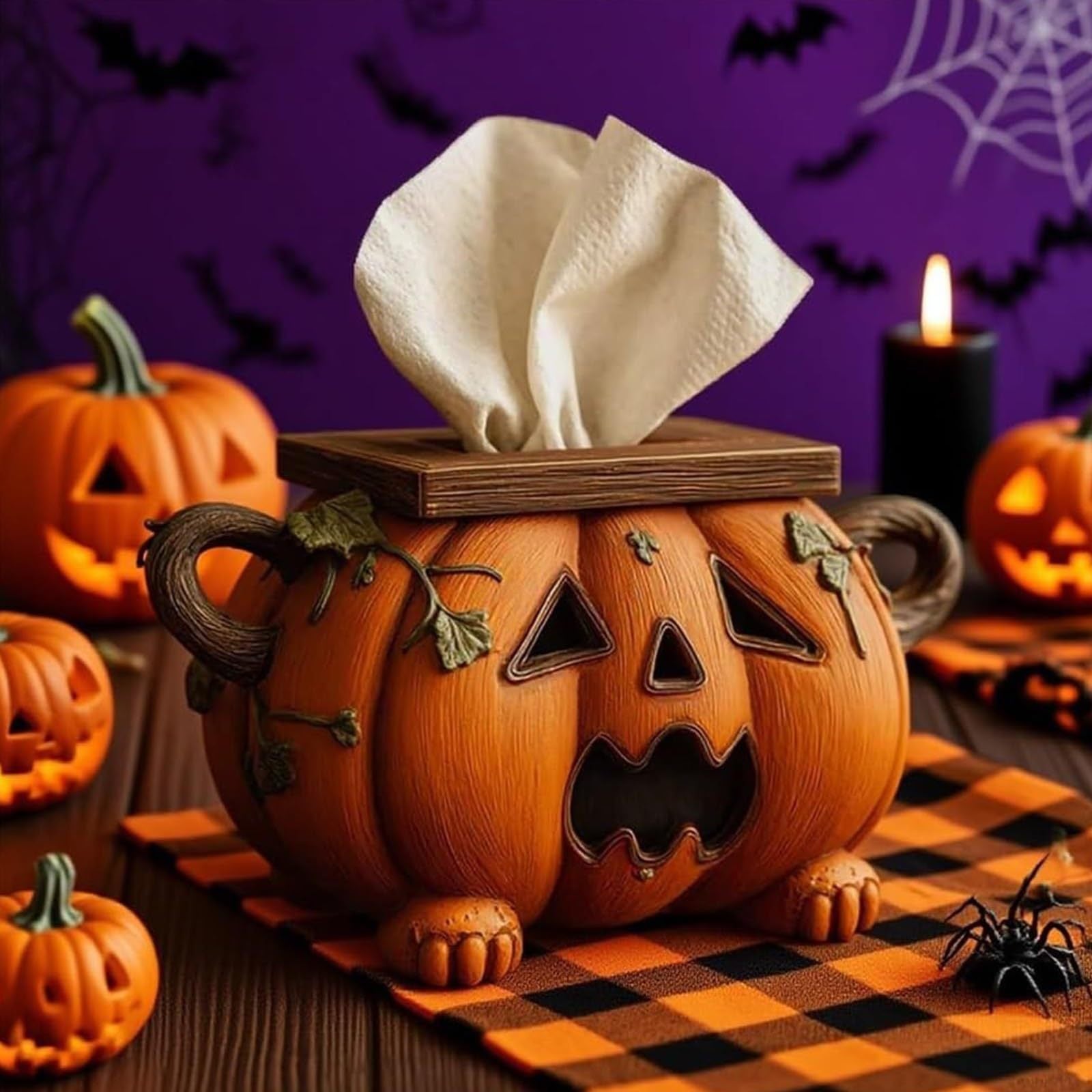 Pumpkin-shaped tissue box with tissues on a Halloween-themed background with pumpkins and spiders.