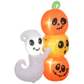 Inflatable ghost and pumpkins with faces on a white background