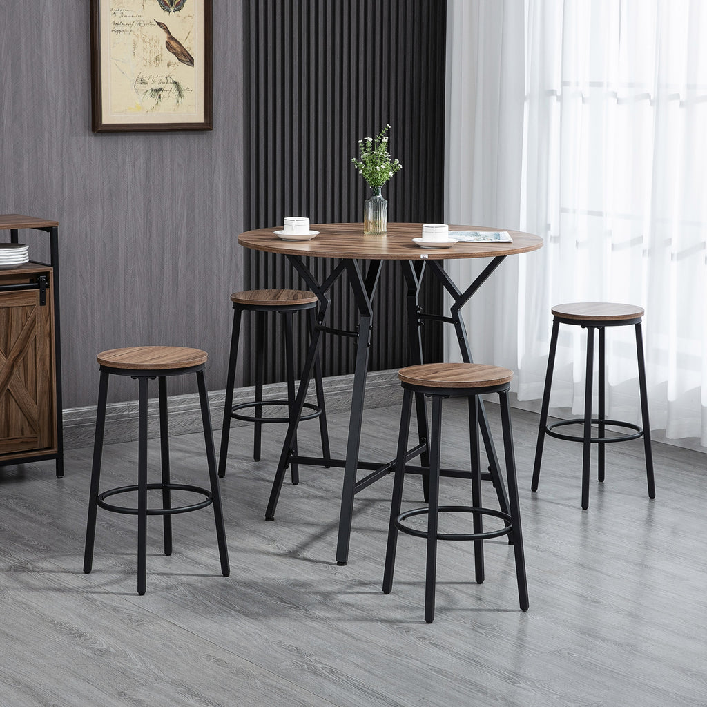 Round wooden table with stools in a room with gray walls and a window.