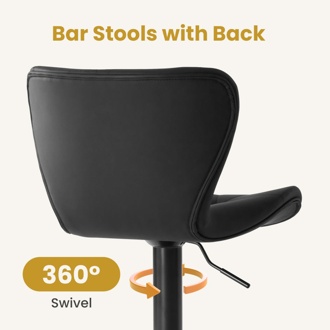 Two swivel bar stools with cushioned seats positioned at a modern kitchen island with wood cabinetry