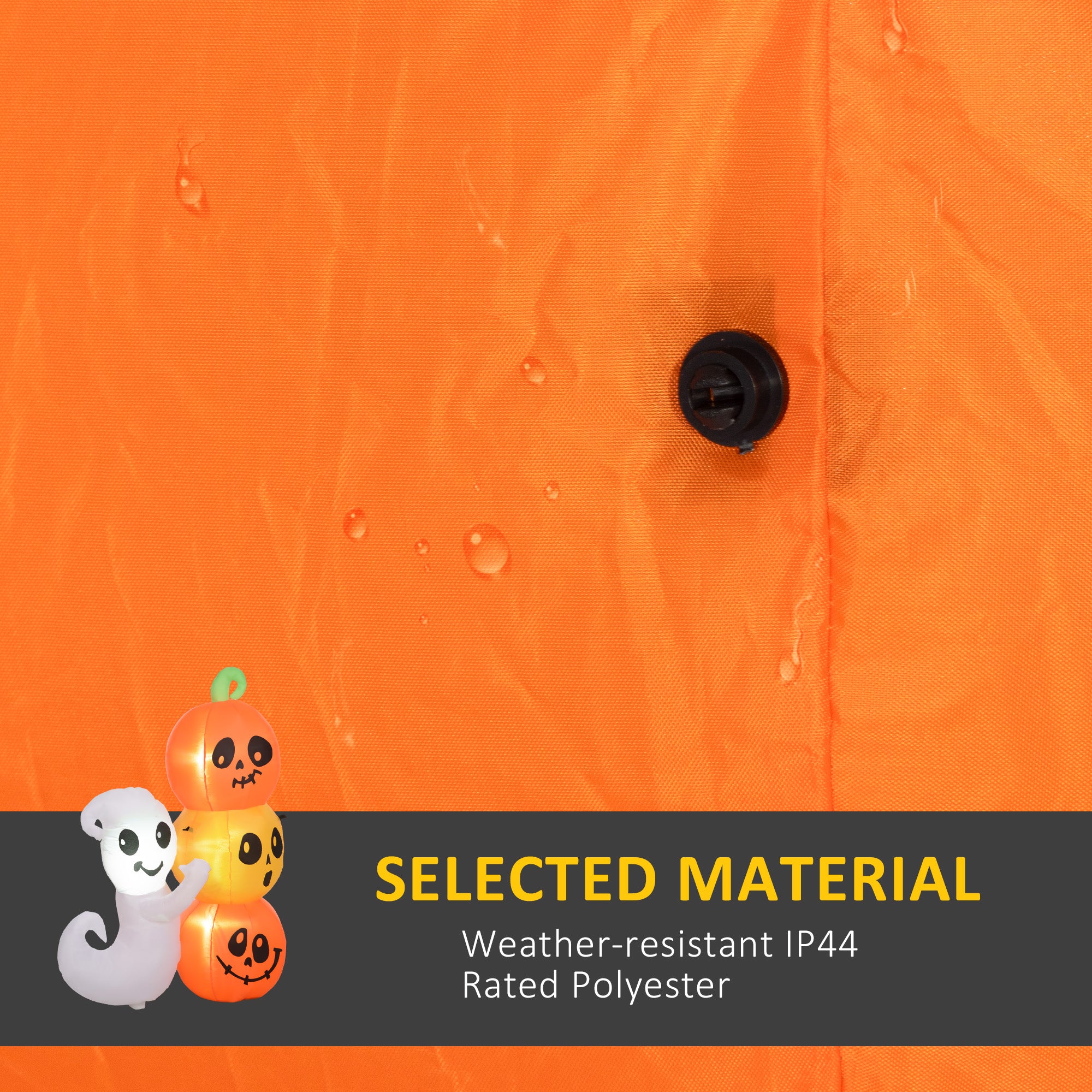 Orange fabric with a button and Halloween-themed decorations on a black banner.