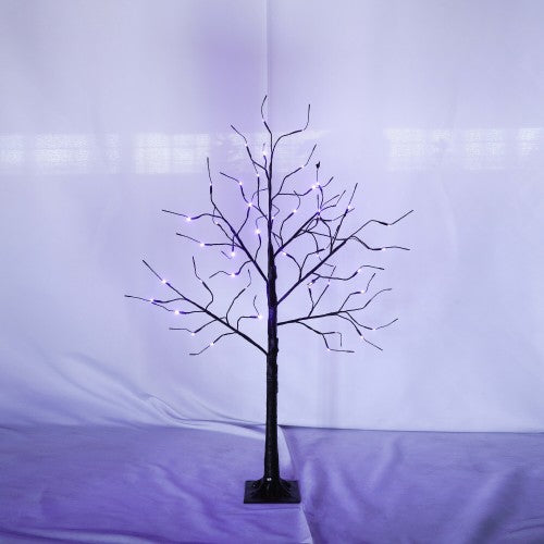 Decorative LED tree with purple and white lights on a plain background