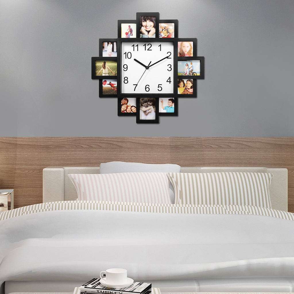 Wall clock with photo frames displaying family photos above a bed in a bedroom.