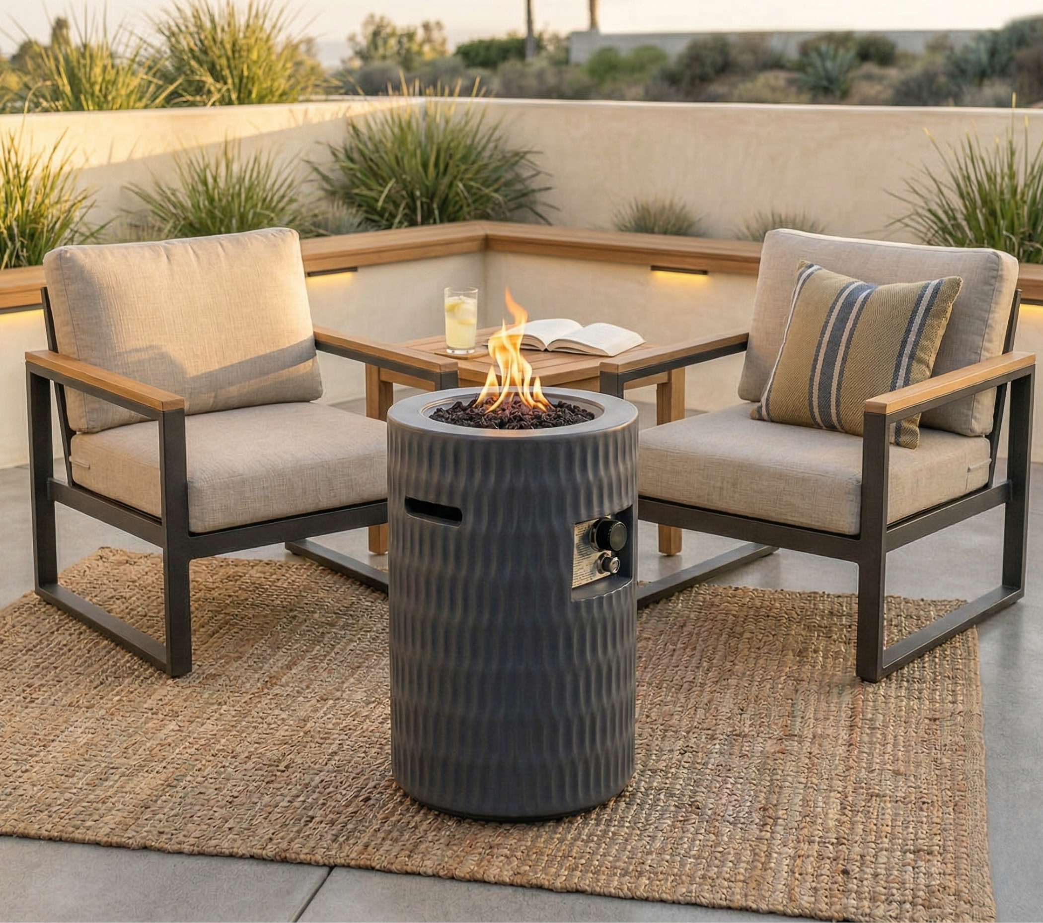 Outdoor patio setting with two chairs, a fire pit, and a table with a candle and book.
