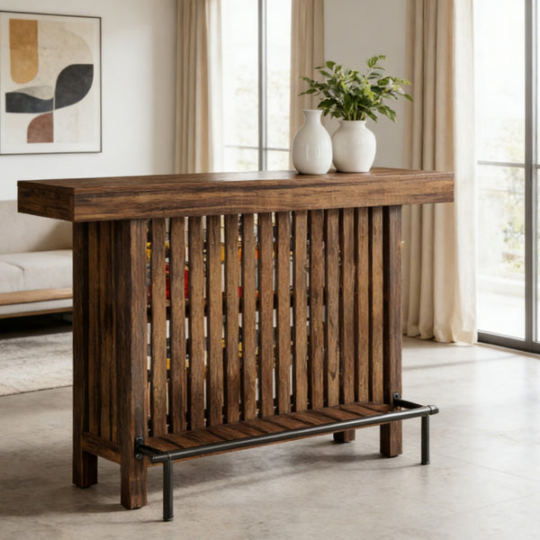 Walnut slatted wood bar table with metal footrest rail and lower storage shelf styled in a modern living room