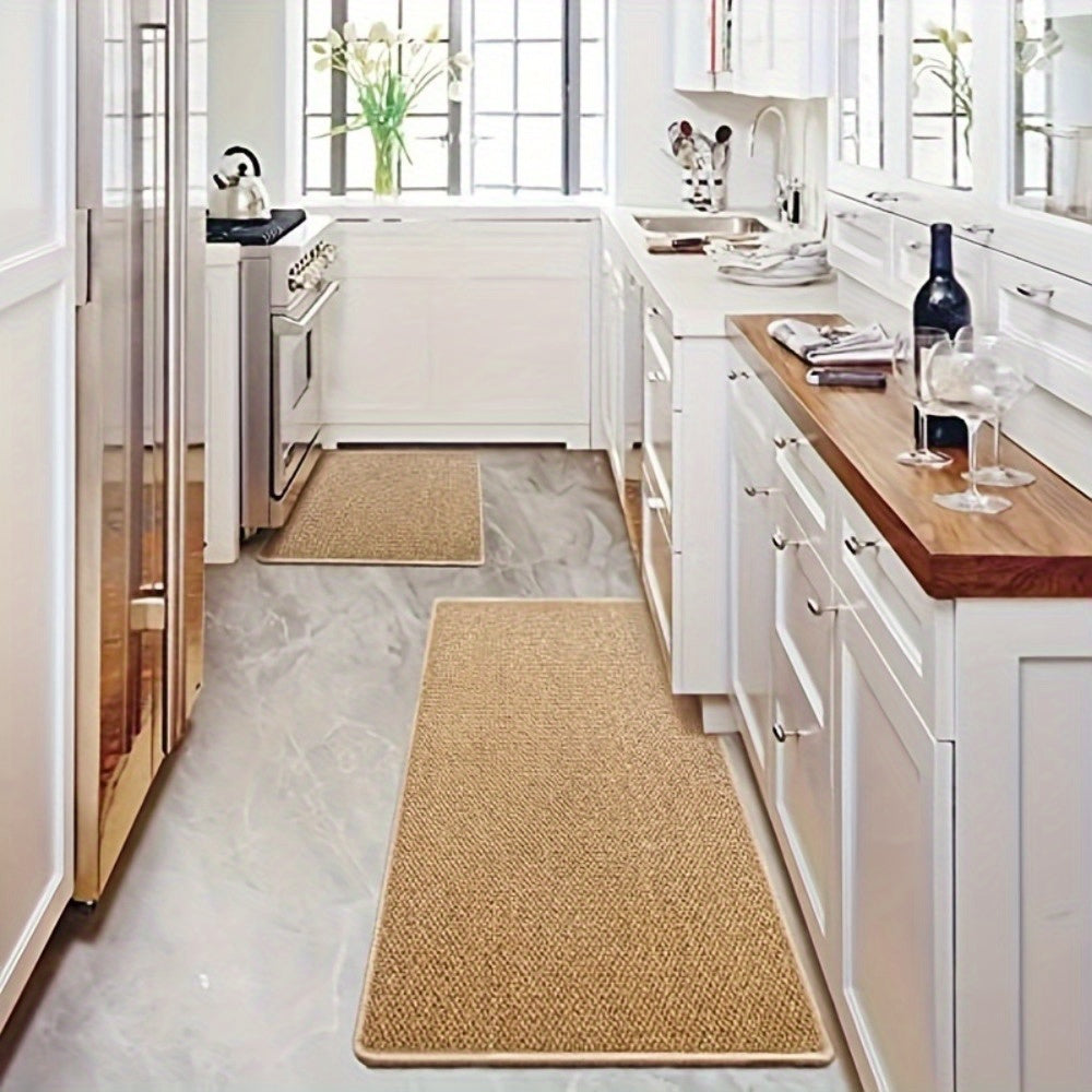 Kitchen with two beige rugs on the floor