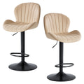 Two swivel bar stools with cushioned seats positioned at a modern kitchen island with wood cabinetry