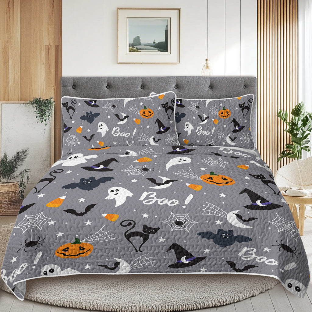 Halloween-themed bedding set on a bed in a bedroom.