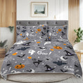 Halloween-themed bedding set on a bed in a bedroom.