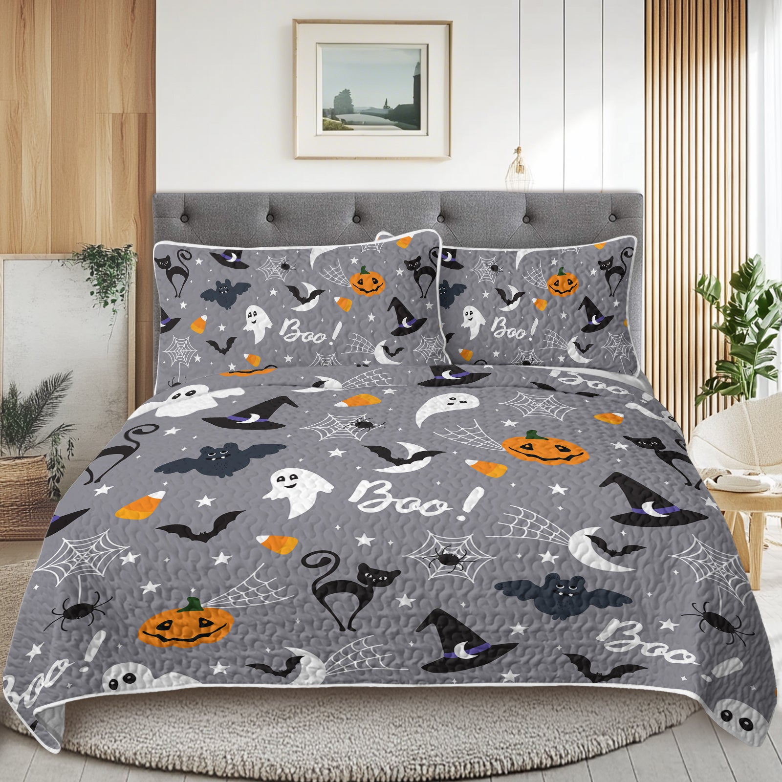Halloween-themed bedding set on a bed in a bedroom.