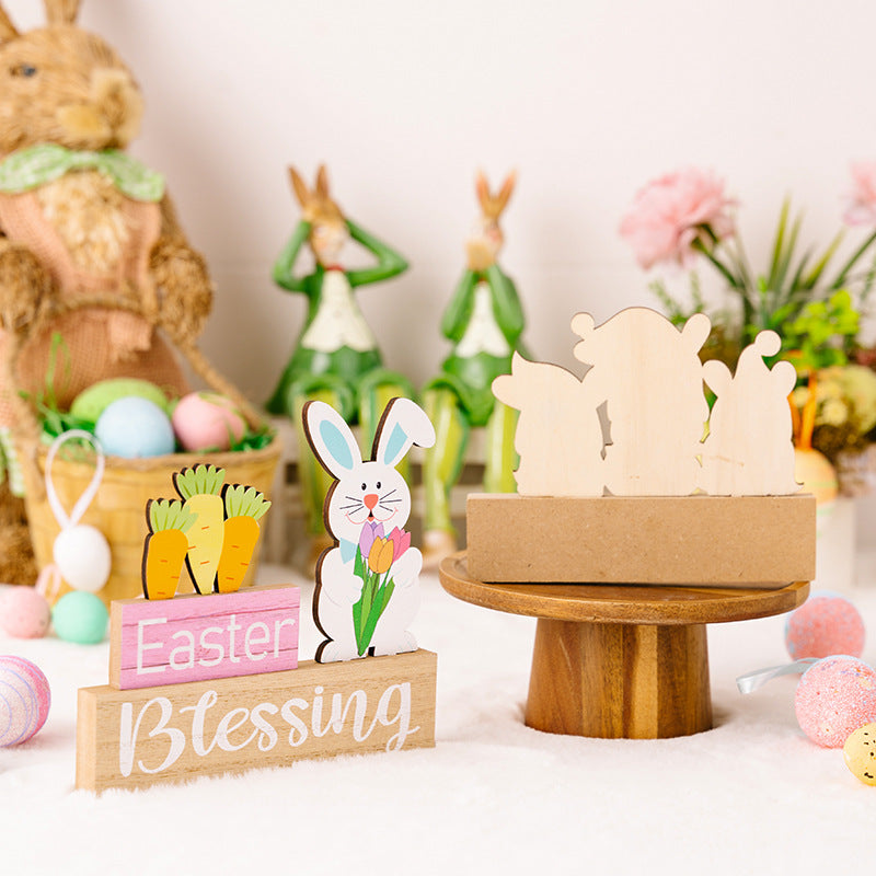 Decorative Easter display with wooden rabbit figures, colorful eggs, and a 'Easter Blessing' sign.