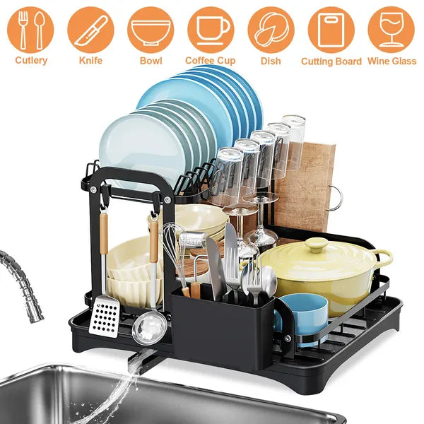 Dish drying rack with various dishes and utensils on a white background