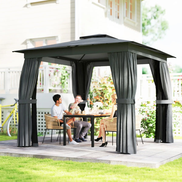 People sitting at a table under a black outdoor gazebo with curtains on a patio.