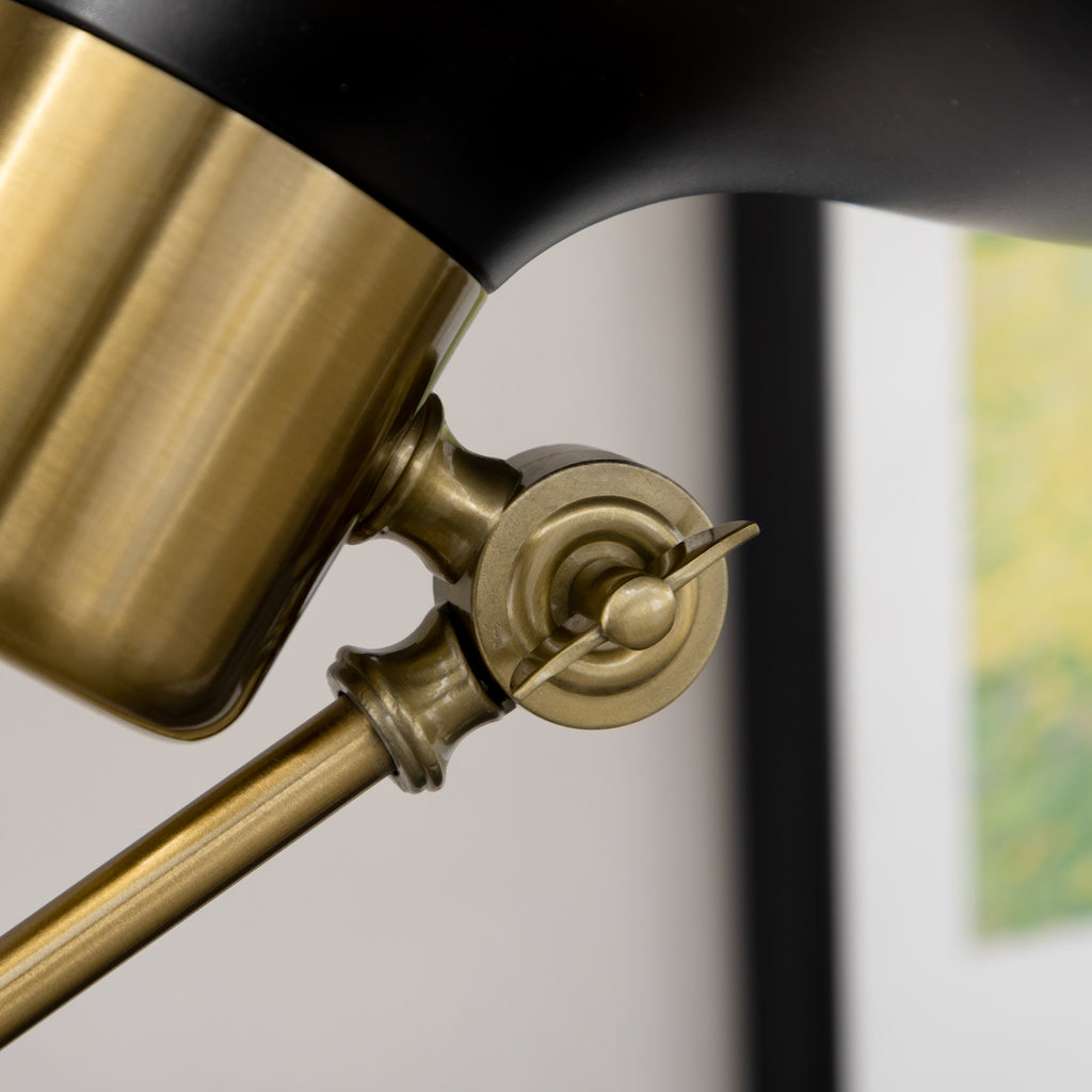 Close-up of a gold and black lamp with blurred background