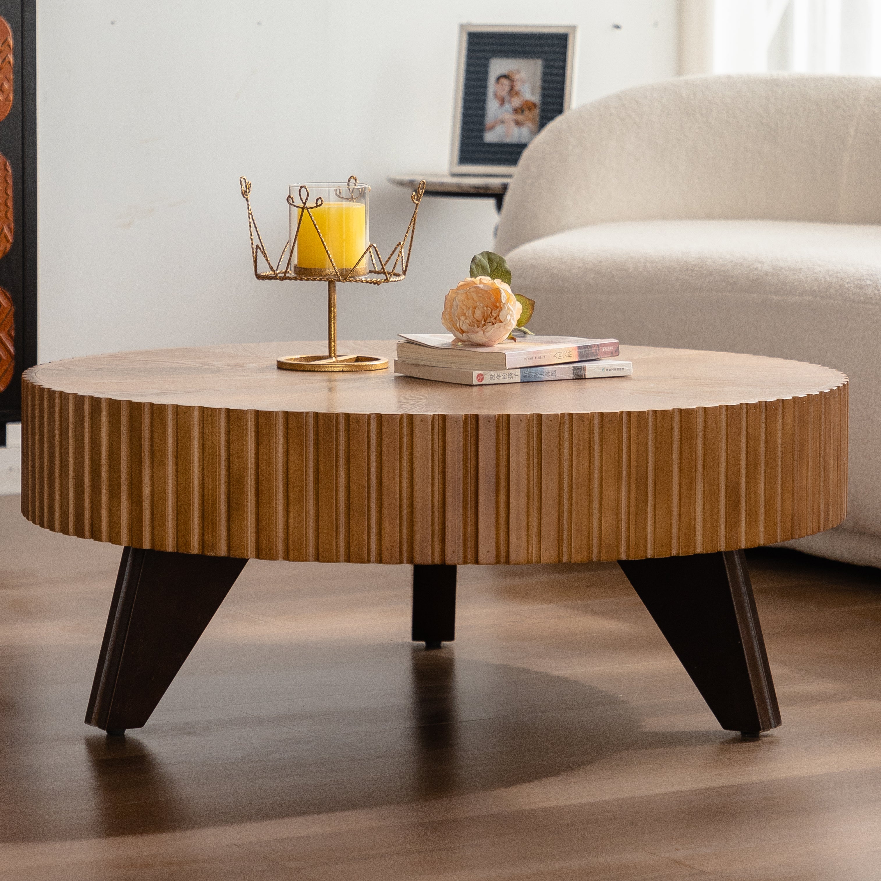 Wooden coffee table with decorative items in a living room setting