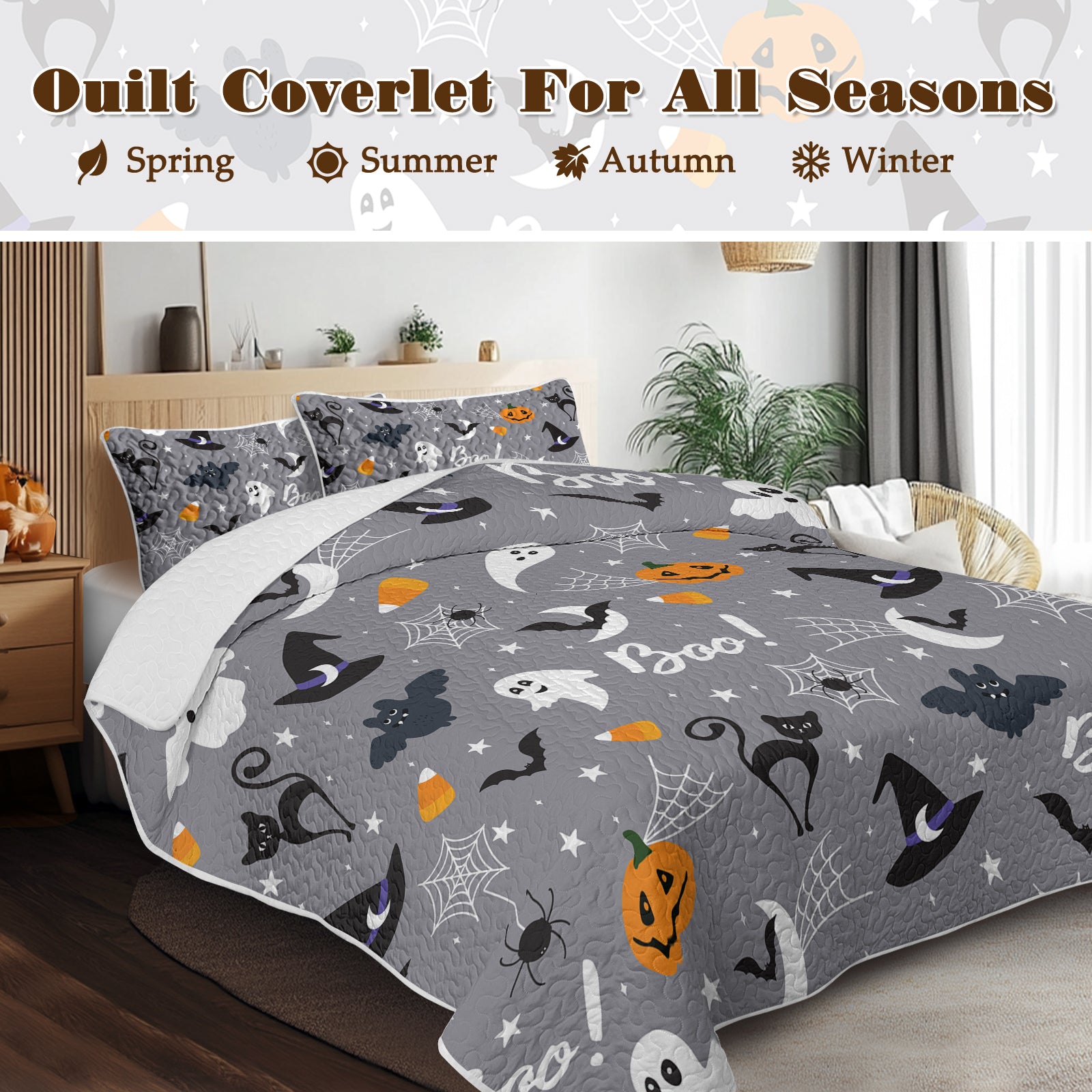 Gray quilt coverlet with Halloween-themed design on a bed in a bedroom setting.