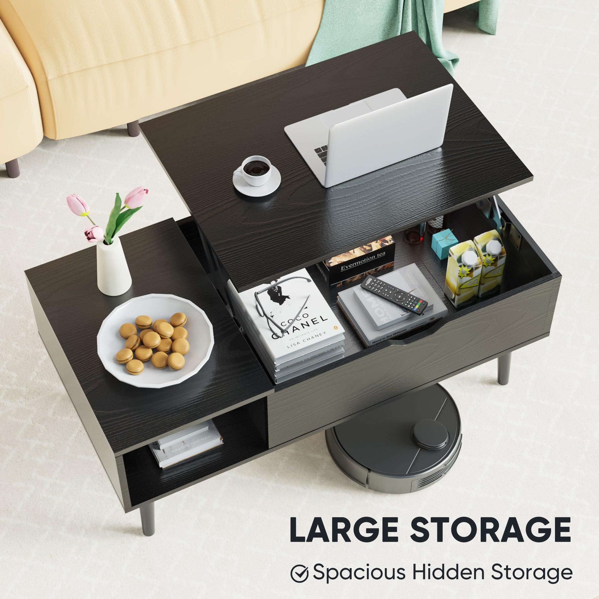 Coffee table with large storage compartment, laptop, and other items on a light background.